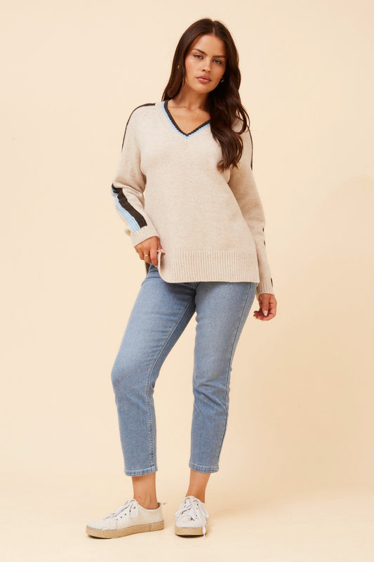 Image of a model wearing Outerwear. Product name - BRYSON STRIPE PRINT KNIT PULLOVER in Oatmeal colour by brand - Caroline Morgan Australia