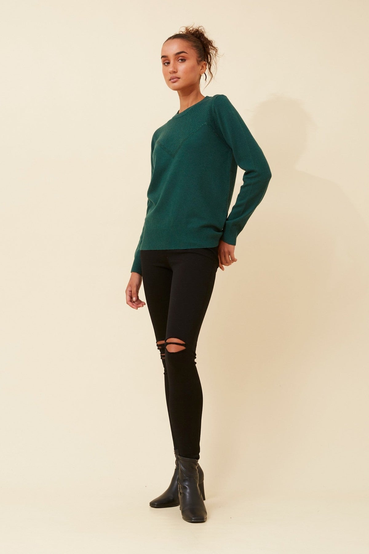 Image of a model wearing Outerwear. Product name - ANGIE DIAMANTE KNIT PULLOVER in Black colour by brand - Caroline Morgan Australia