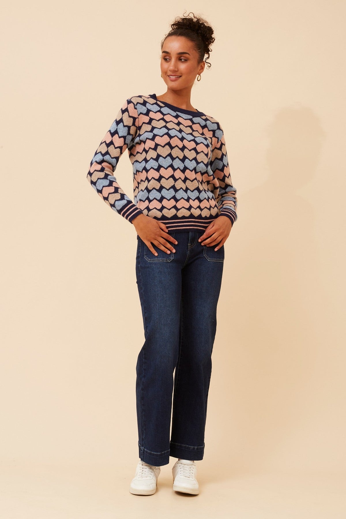 Image of a model wearing Outerwear. Product name - JUNA HEART PRINT KNIT JUMPER in Multi Navy colour by brand - Caroline Morgan Australia