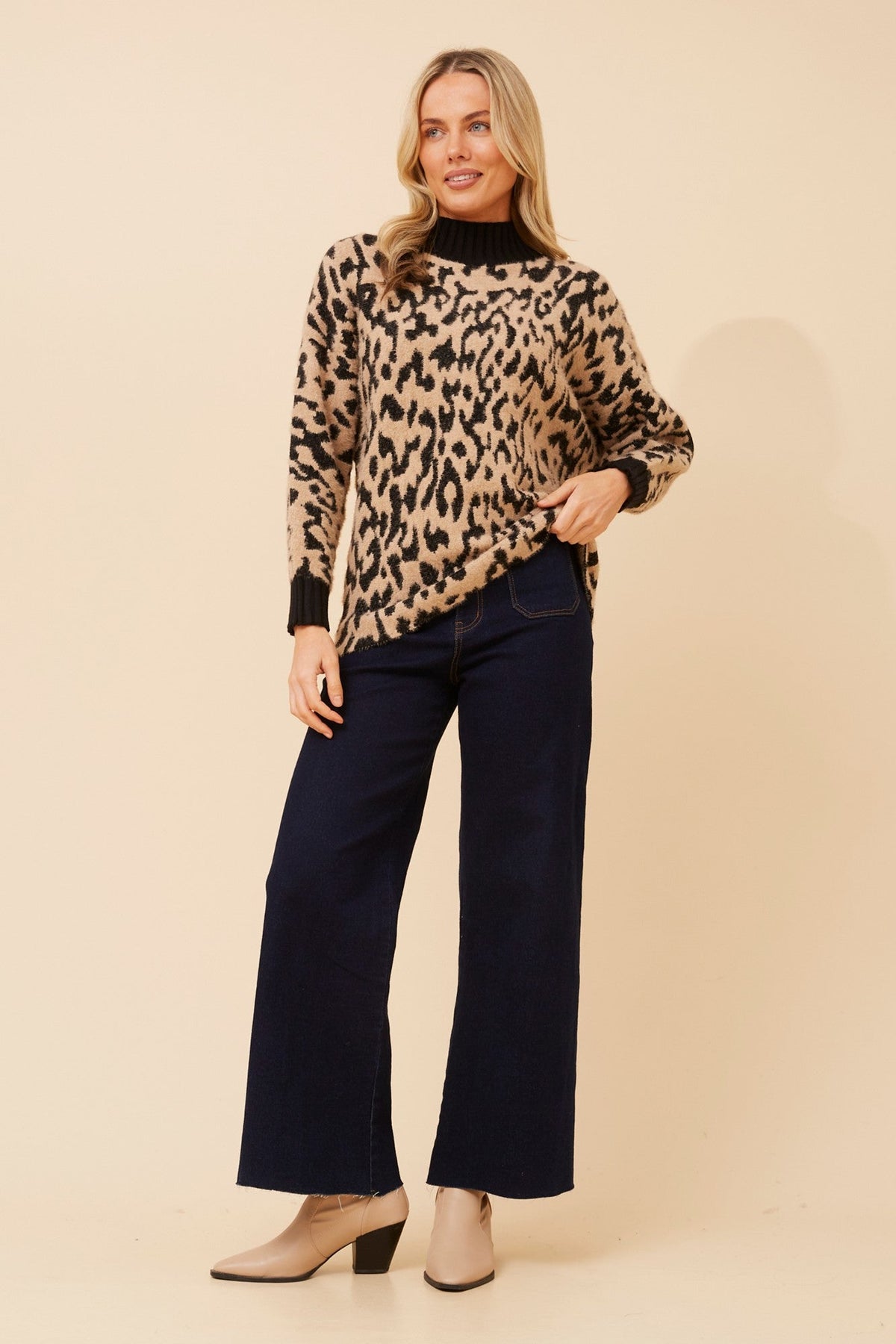 Image of a model wearing Outerwear. Product name - CANYON ANIMAL PRINT KNIT PULLOVER in Multi Beige colour by brand - Caroline Morgan Australia