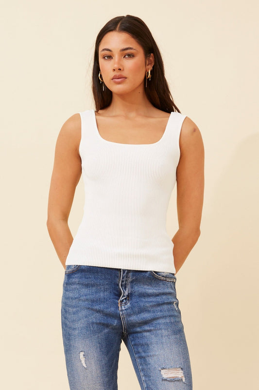 Image of a model wearing Tops. Product name - KIENNA SLEEVELESS KNIT TOP in White colour by brand - Caroline Morgan Australia