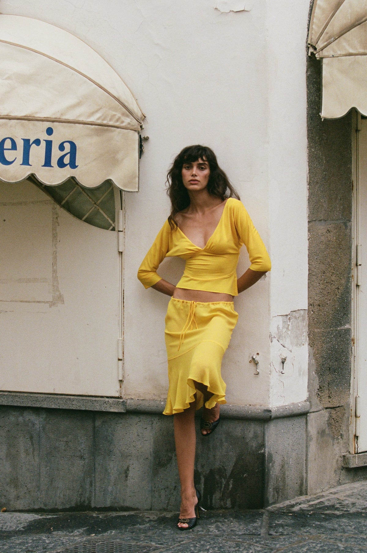 Image of a model wearing Tops. Product name - Lana Top in Golden Yellow colour by brand - With Jéan