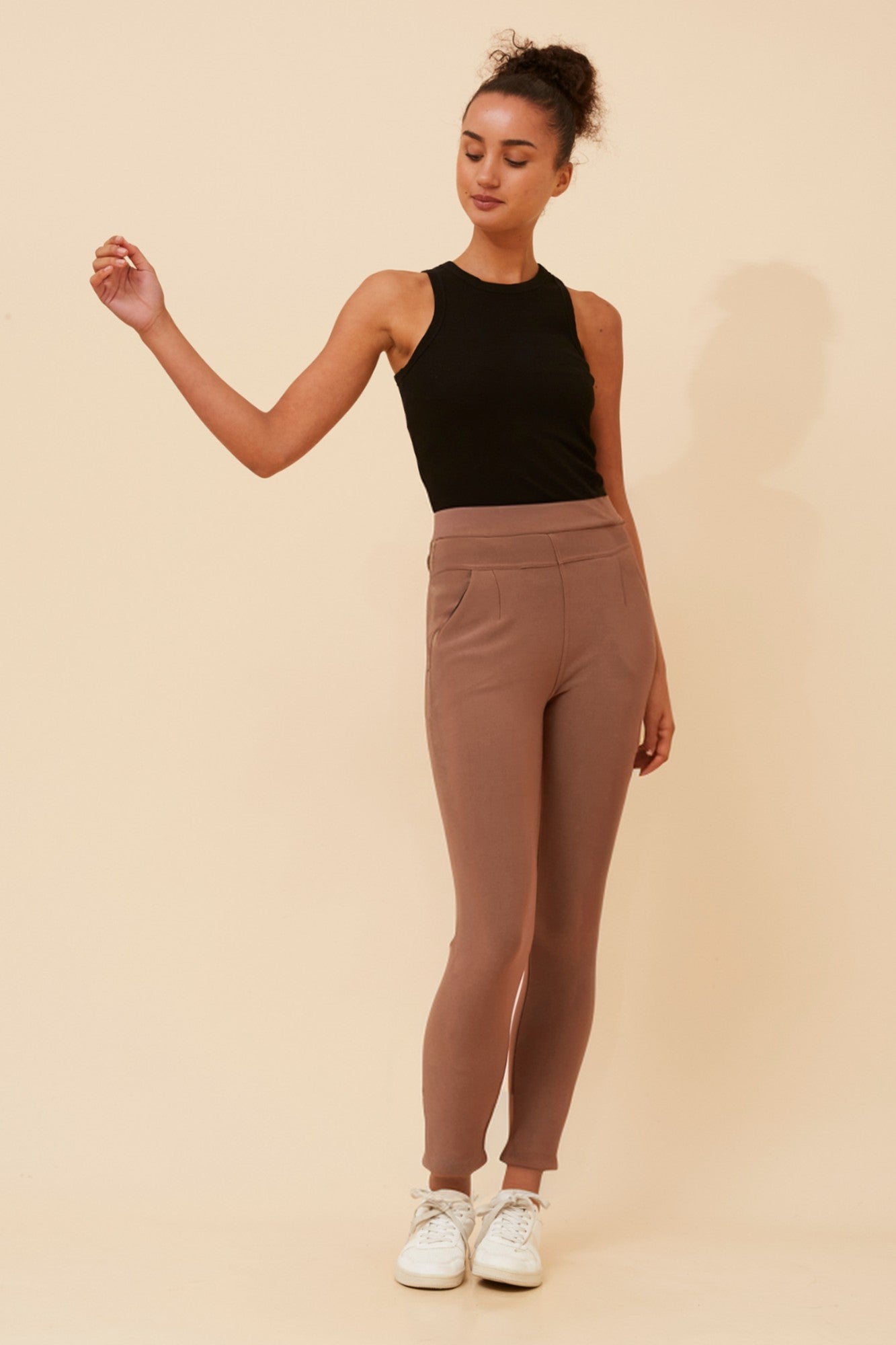 Image of a model wearing Pants. Product name - ISRA SOLID PANTS in Black colour by brand - Caroline Morgan Australia