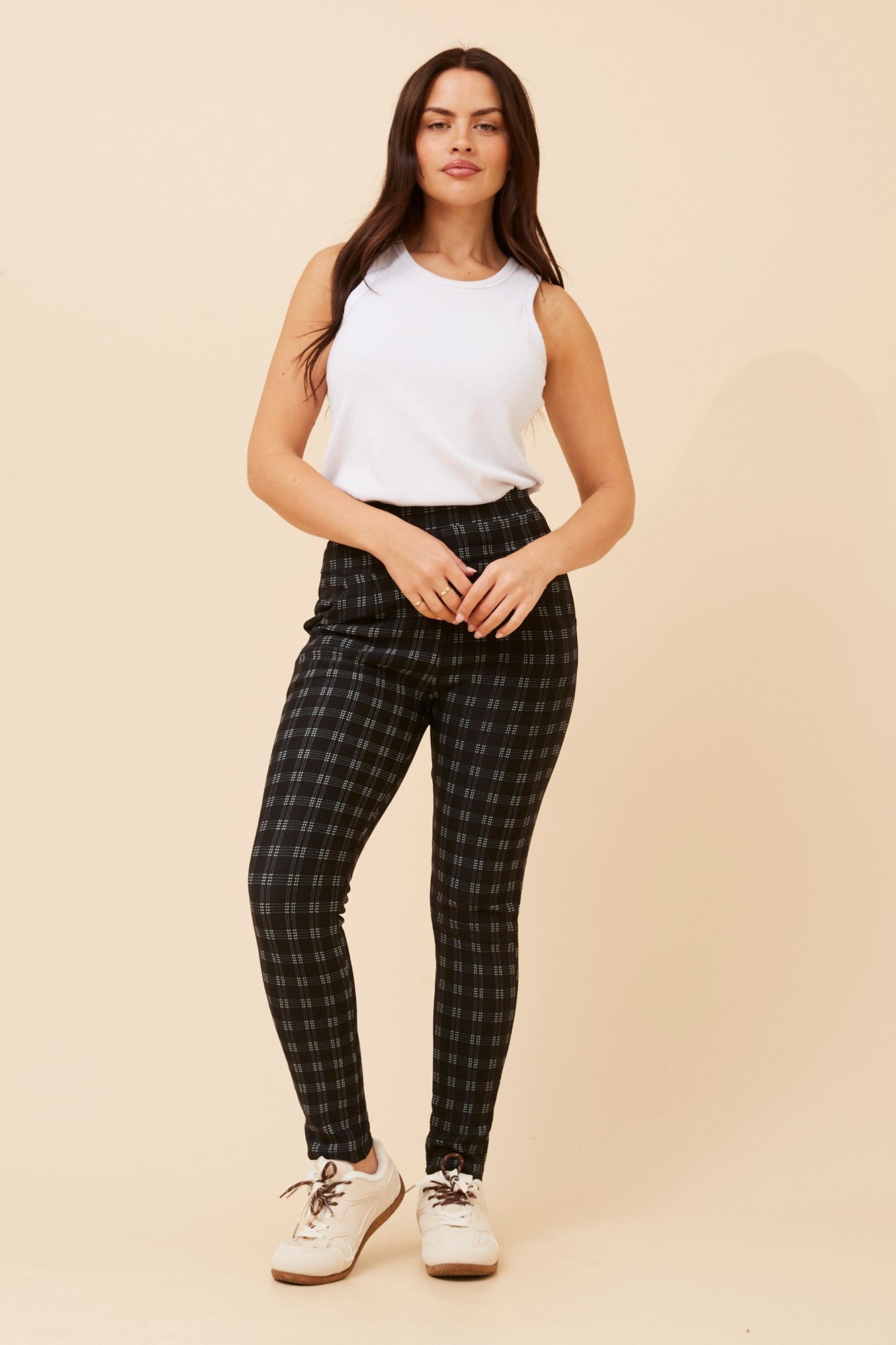 Image of a model wearing Pants. Product name - BELLEANNE CHECK PRINT LEGGINGS in Black colour by brand - Caroline Morgan Australia
