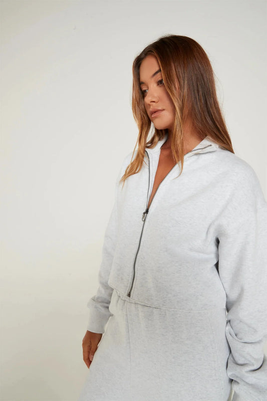 Image of a model wearing Outerwear. Product name - Lily Full Zip Sweater in White colour by brand - All Fenix
