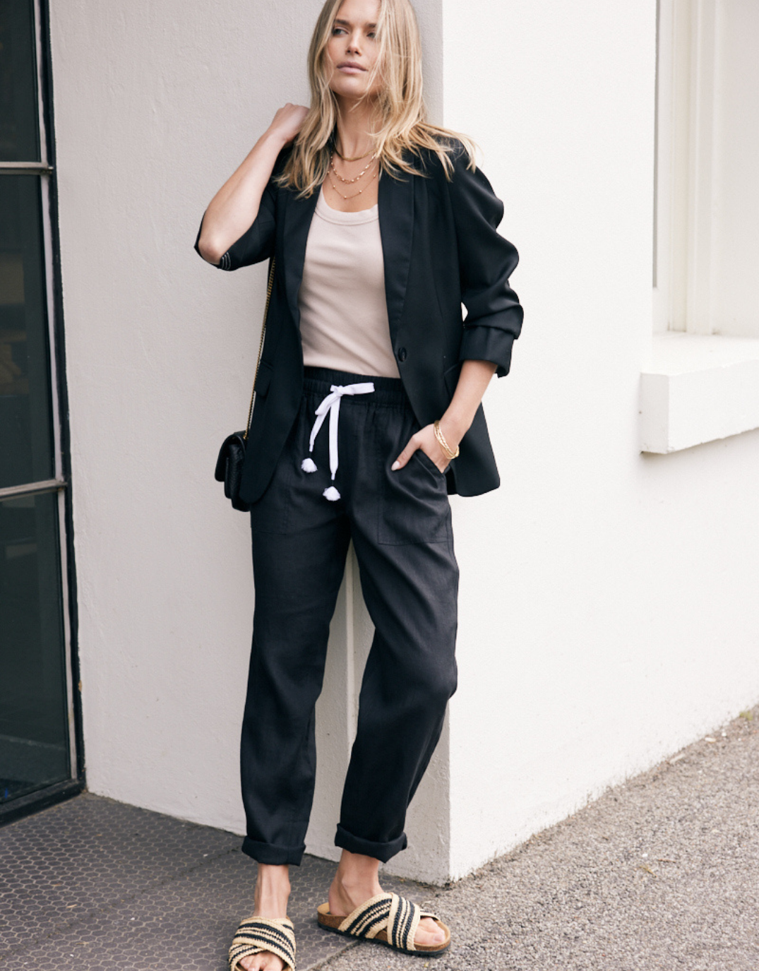 Image of a model wearing Pants. Product name - Linen Beach Comber Pant Black in Black colour by brand - White & Co.