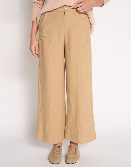 Image of a model wearing Pants. Product name - Jude Wide Leg Linen Pant Camel in Camel colour by brand - Little Lies
