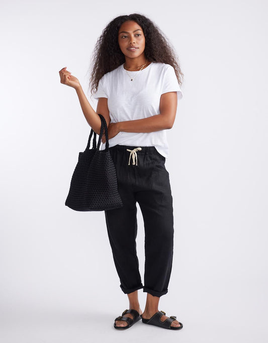 Image of a model wearing Pants. Productname: Luxe Linen Pants - in Black colour by brand - Little Lies