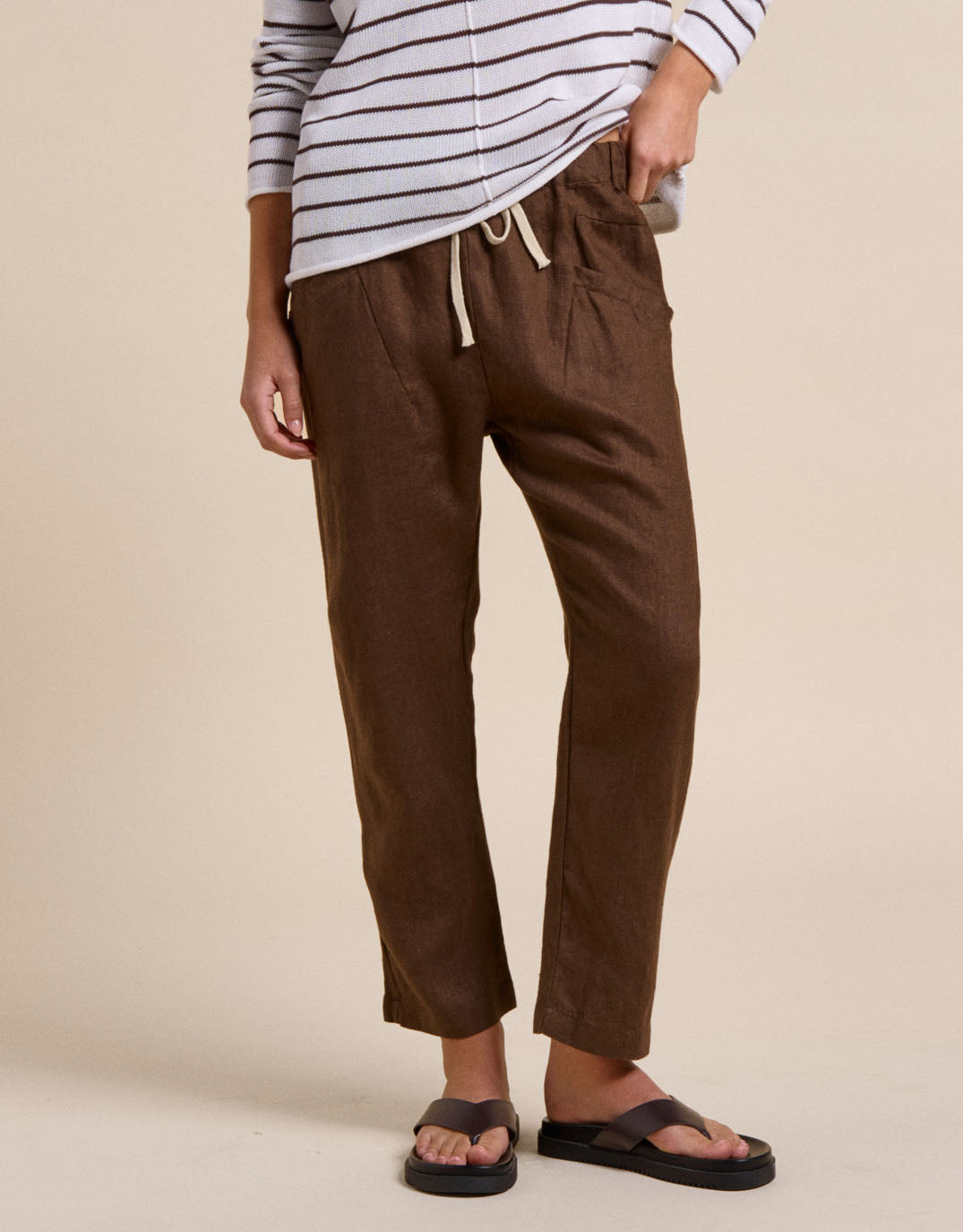 Image of a model wearing Pants. Productname: Luxe Linen Pants - in Chocolate colour by brand - Little Lies