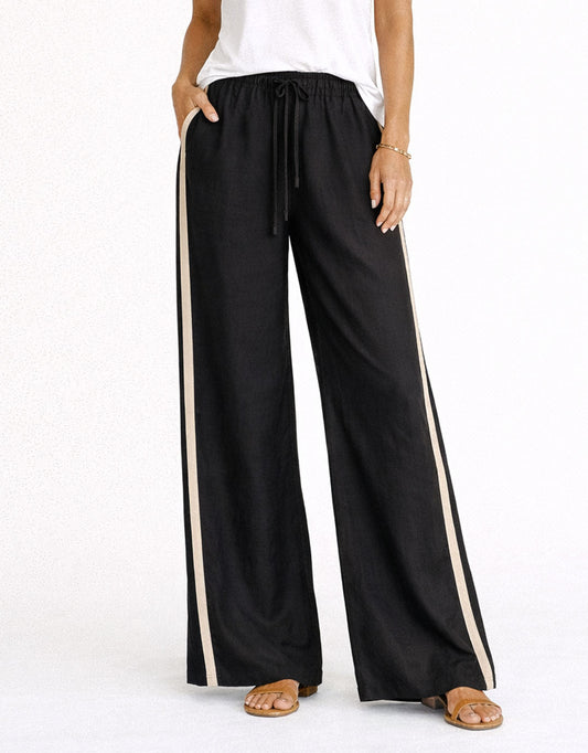 Image of a model wearing Pants. Productname: Monaco Pants - in Black/Natural colour by brand - Little Lies
