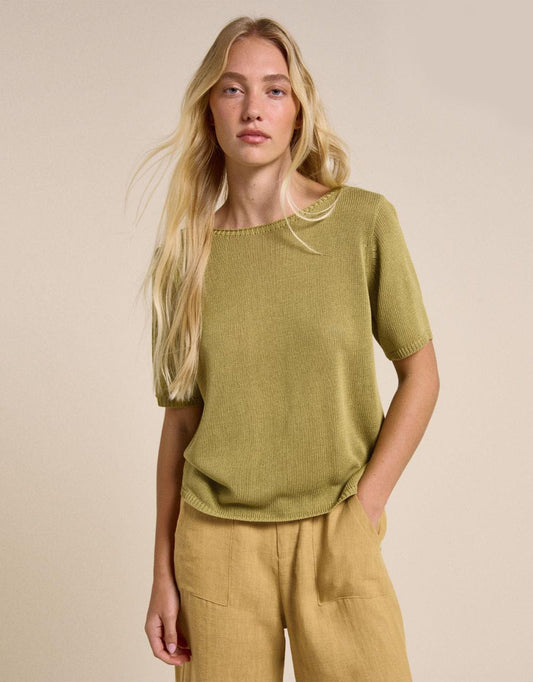 Image of a model wearing Outerwear. Productname: Spring Tee - in Olive colour by brand - Little Lies