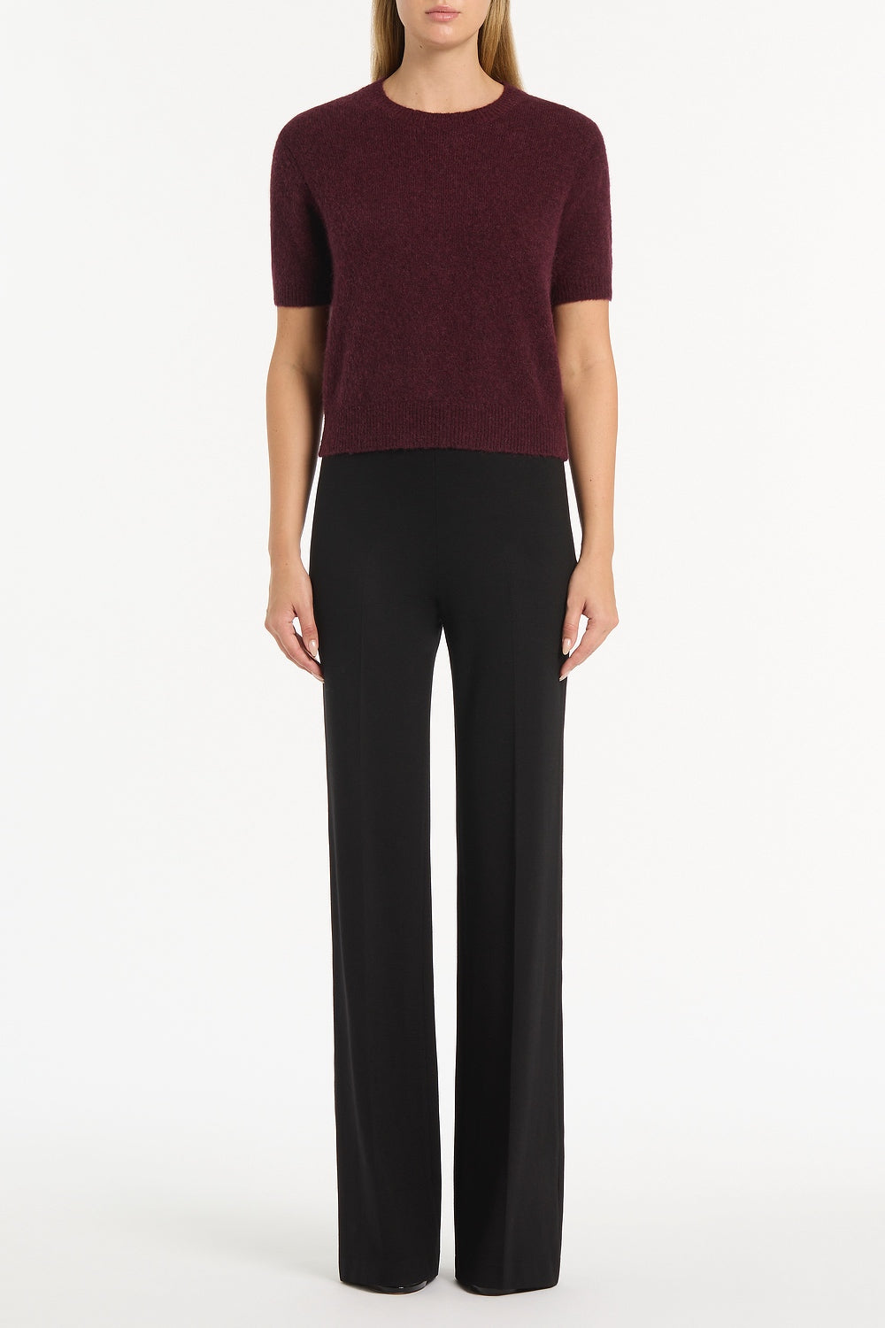 Image of a model wearing Tops. Product name - Loganberry Brushed Knit Top in Purple colour by brand - Carla Zampatti