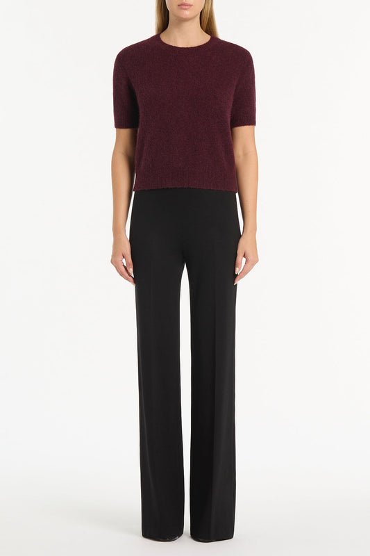 Image of a model wearing Tops. Product name - Loganberry Brushed Knit Top in Purple colour by brand - Carla Zampatti