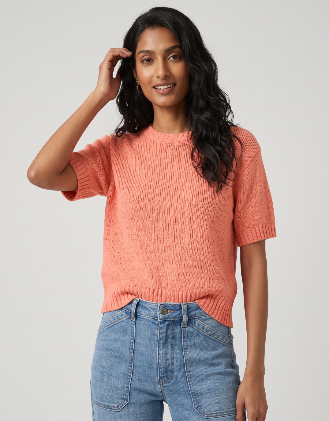 Image of a model wearing Outerwear. Product name - Loveable Tape Yarn Knit Tee Melon in Melon colour by brand - By Rosa