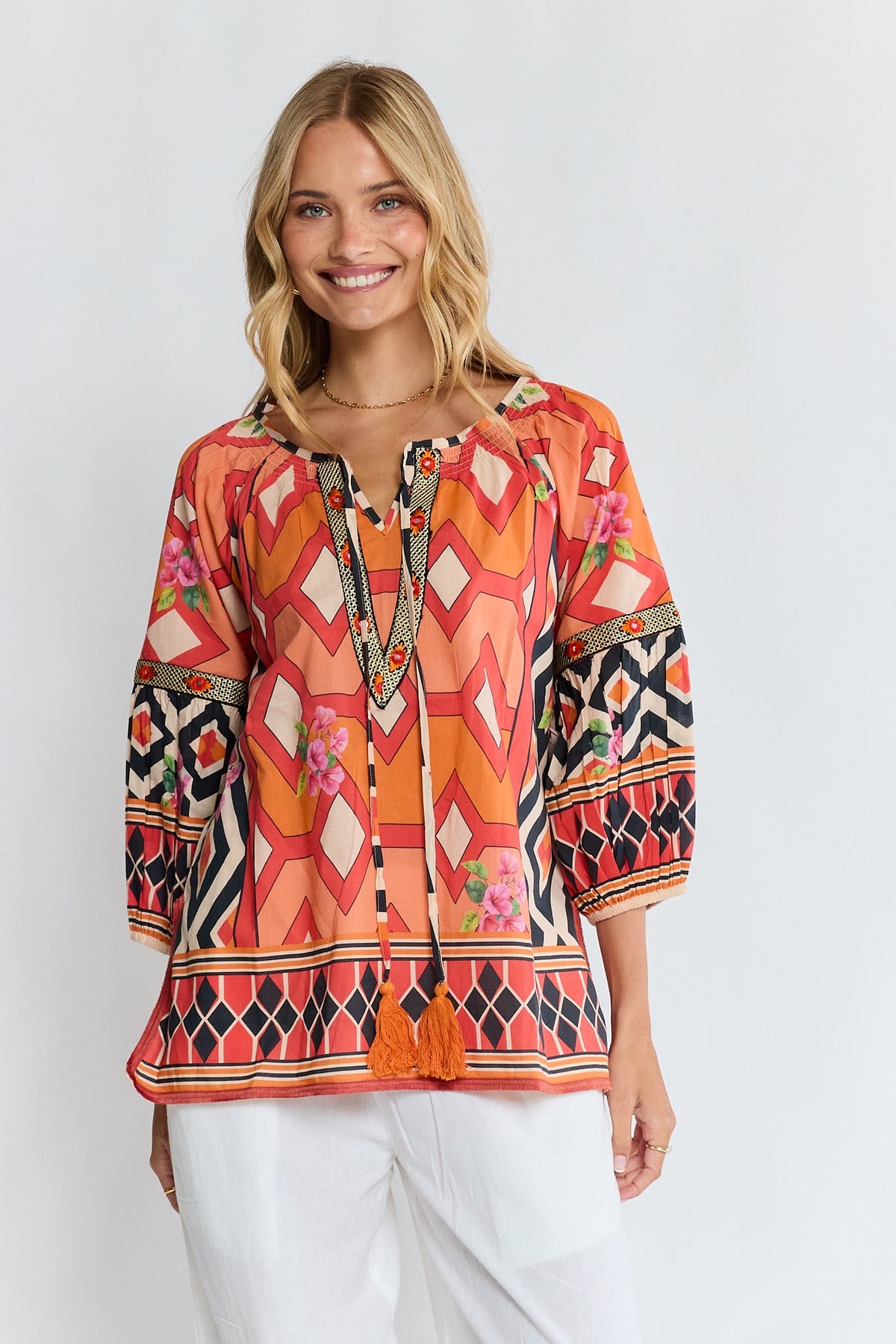 Image of a model wearing Tops. Product name - PRE SALE | LulaLife Bella Vista Top Tangerine in Tan colour by brand - Lulalife