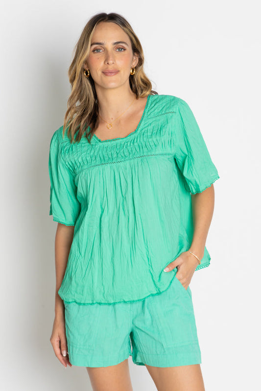 Image of a model wearing Tops. Productname: LulaLife Celeste Cropped Top Sea in Sea colour by brand - Lulalife