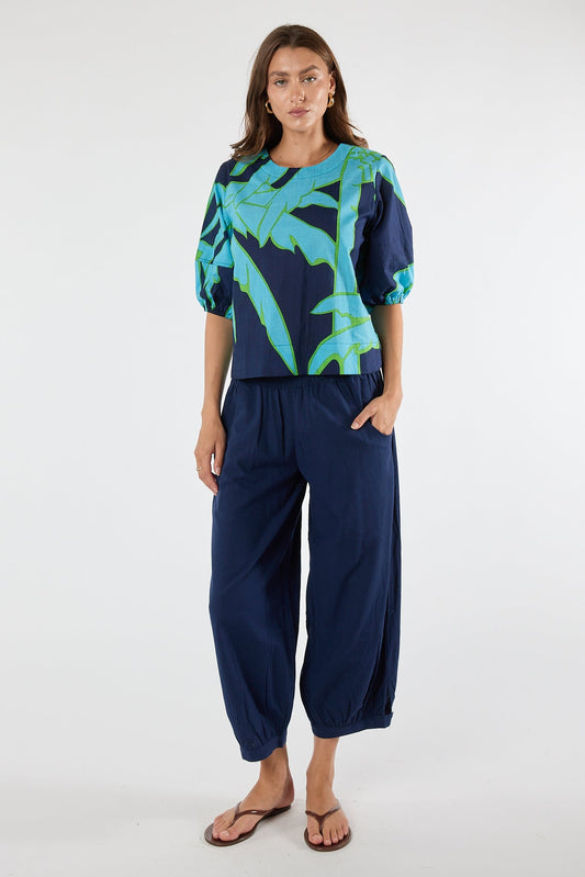 Image of a model wearing Tops. Product name - PRE SALE | LulaLife Colette Top Navy in Navy colour by brand - Lulalife