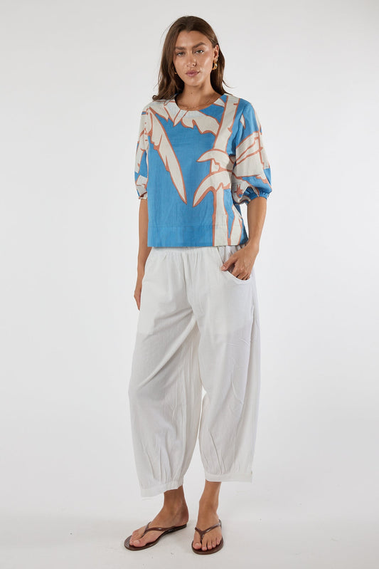 Image of a model wearing Tops. Product name - PRE SALE | LulaLife Colette Top Sky in Sky colour by brand - Lulalife