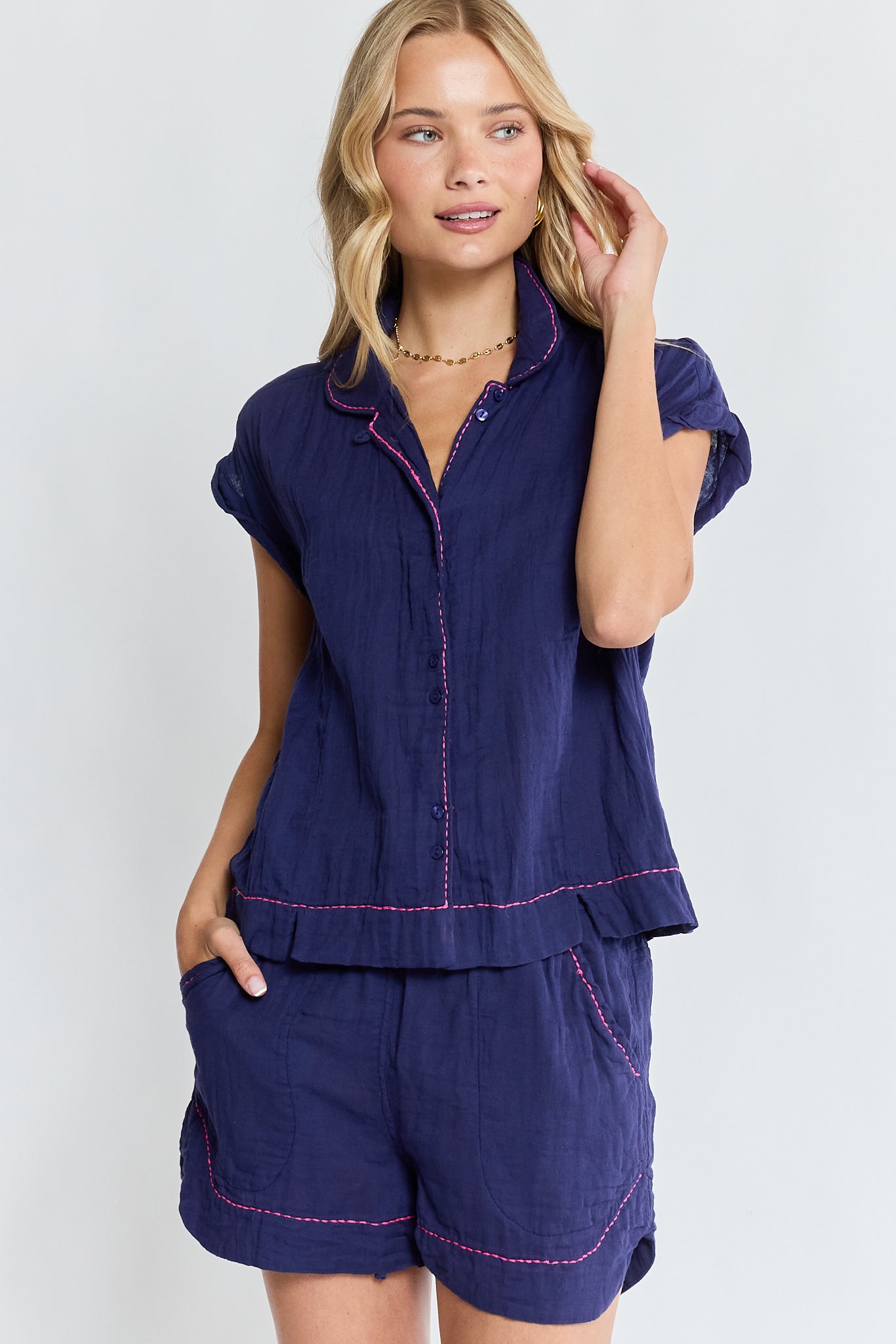 Image of a model wearing Tops. Product name - LulaLife Florida Top Navy in Navy colour by brand - Lulalife