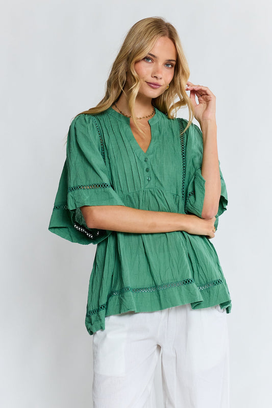 Image of a model wearing Tops. Product name - LulaLife Laverne Pintuck Top Gumleaf in Gumleaf colour by brand - Lulalife
