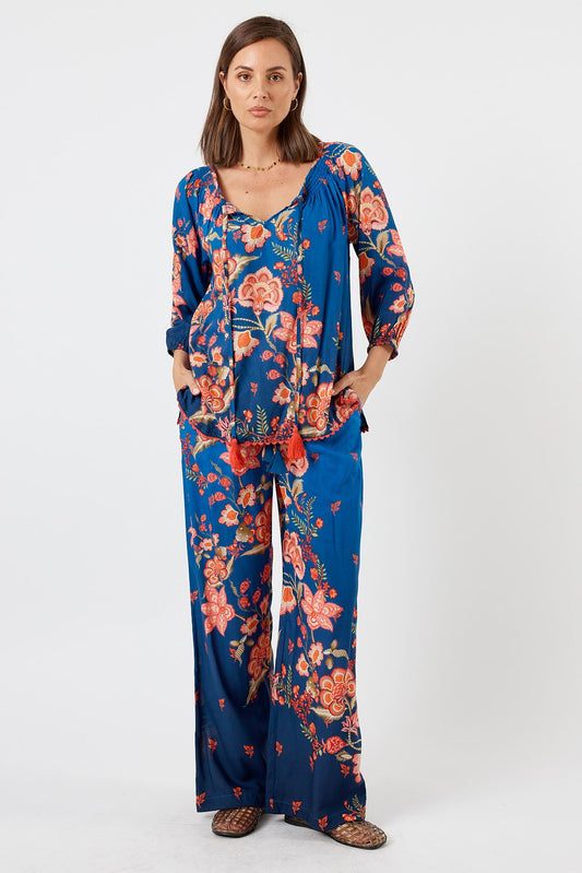 Image of a model wearing Pants. Product name - LulaLife Lovis Pant Ocean in Ocean colour by brand - LulaLife