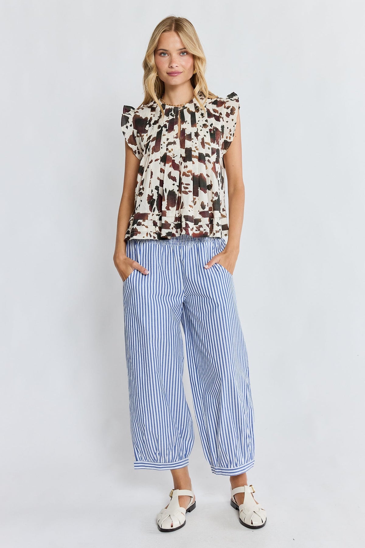 Image of a model wearing Pants. Product name - LulaLife Sylvie Balloon Pant Stripe in Stripe colour by brand - Lulalife