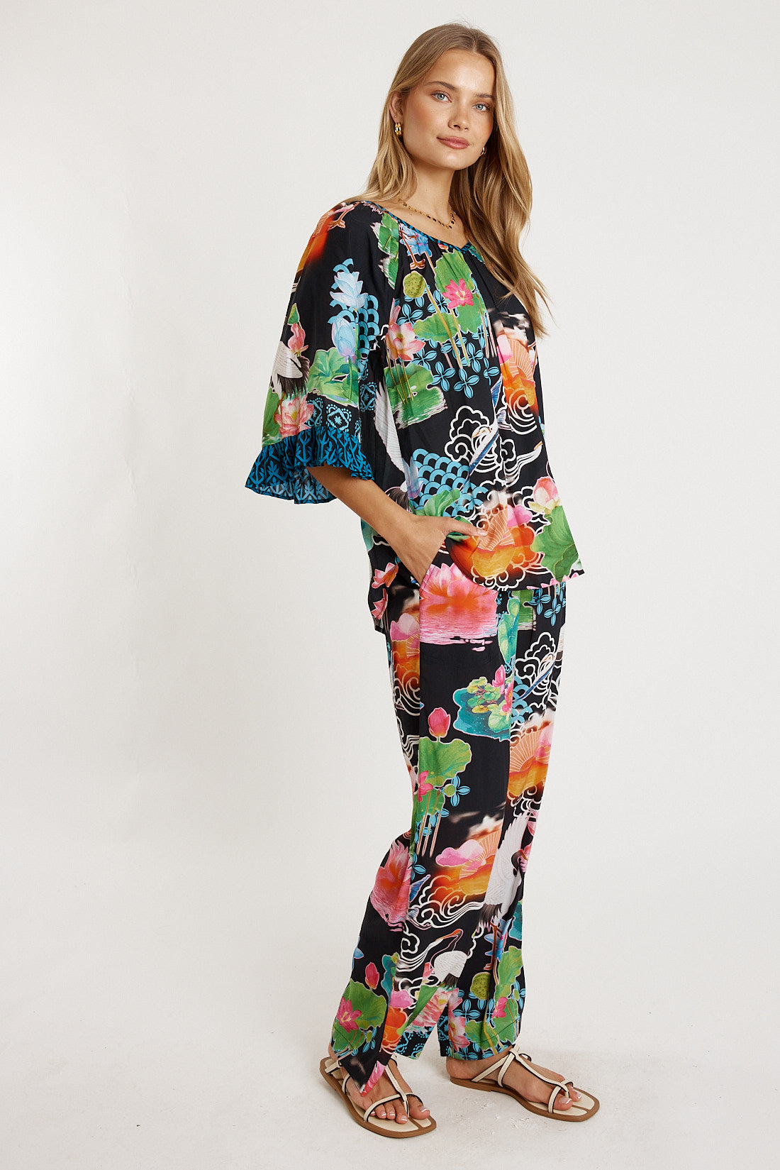 Image of a model wearing Pants. Product name - LulaLife Akiko Pant Ocean in Ocean colour by brand - LulaLife