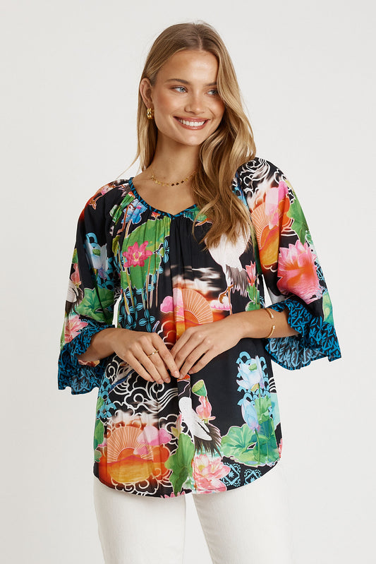 Image of a model wearing Tops. Productname: LulaLife Akiko Top Ocean in Ocean colour by brand - LulaLife