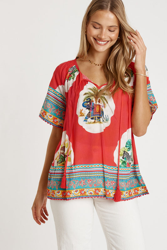 Image of a model wearing Tops. Productname: LulaLife Cyra Top Melon in Melon colour by brand - LulaLife