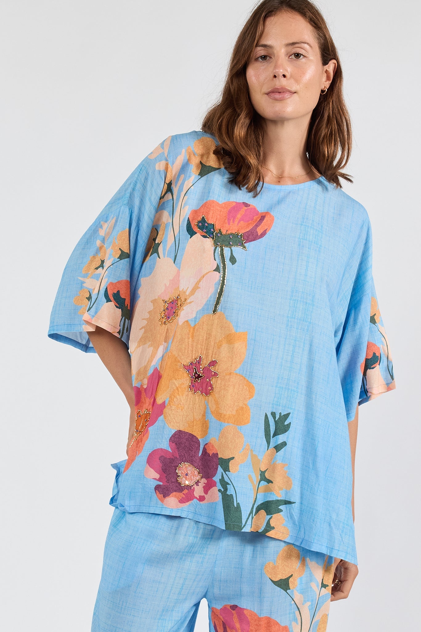 Image of a model wearing Tops. Product name - PRE SALE | LulaSoul Hana Wide T Indigo in Indigo colour by brand - Lulasoul