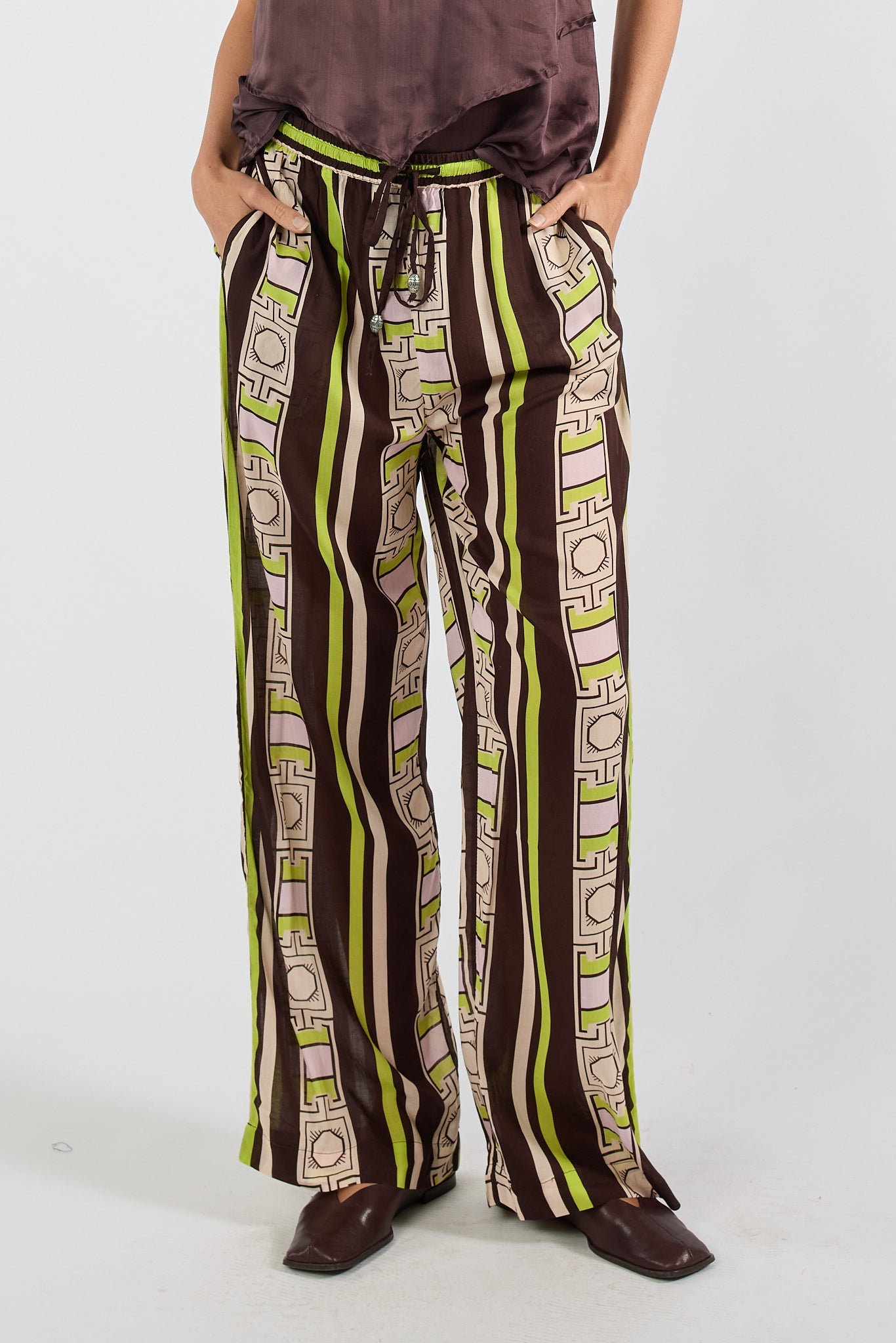 Image of a model wearing Pants. Product name - PRE SALE | LulaSoul Mayakoba Pant Espresso in Espresso colour by brand - Lulasoul