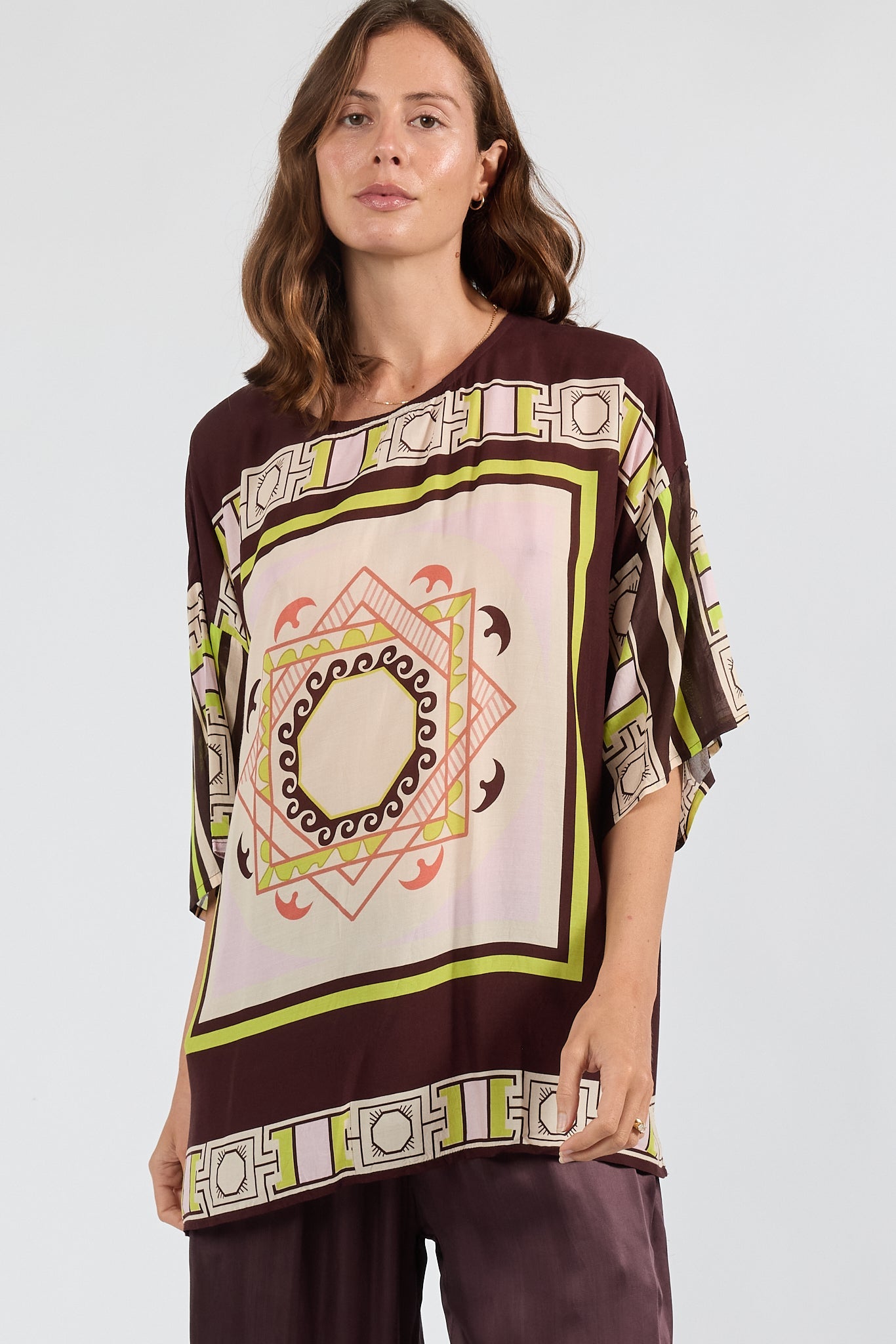 Image of a model wearing Tops. Product name - PRE SALE | LulaSoul Mayakoba Wide T Espresso in Espresso colour by brand - Lulasoul