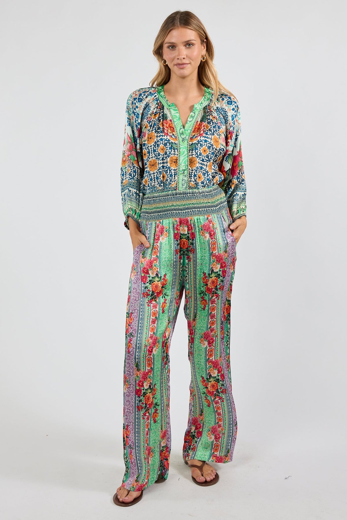 Image of a model wearing Pants. Product name - LulaSoul Miraval Pant Multi in Multi colour by brand - Lulasoul