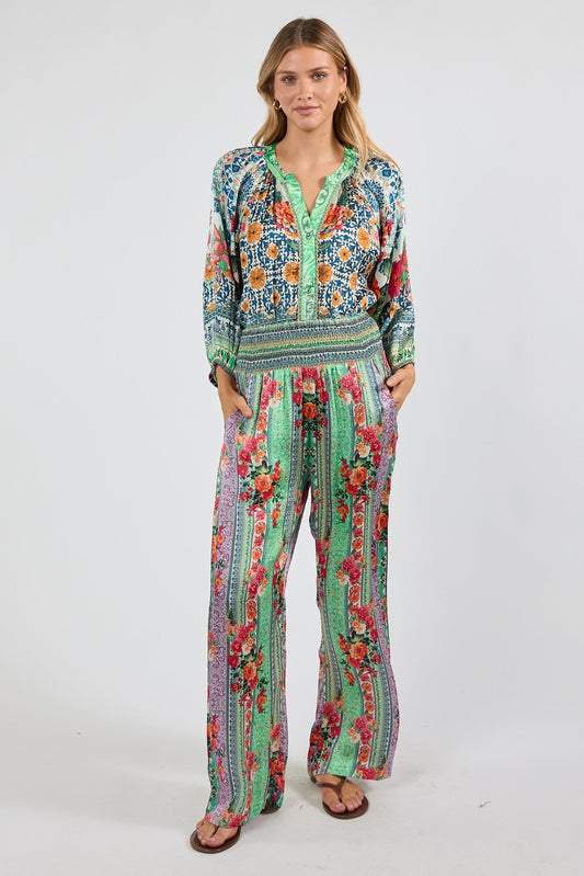 Image of a model wearing Pants. Product name - LulaSoul Miraval Pant Multi in Multi colour by brand - Lulasoul