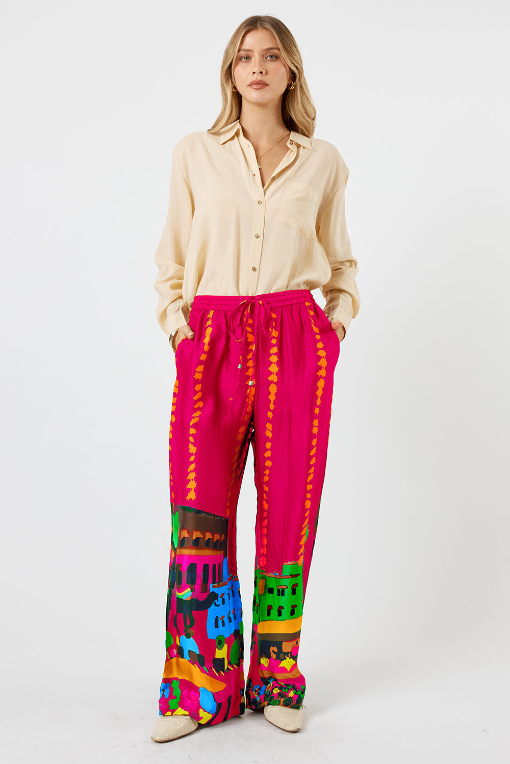 Image of a model wearing Pants. Product name - LulaSoul Surrey Pant Raspberry in Raspberry colour by brand - LulaSoul