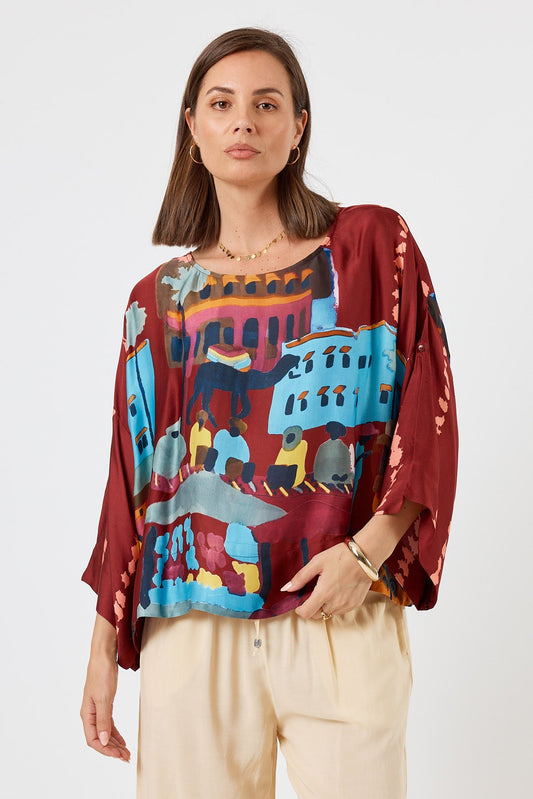 Image of a model wearing Tops. Product name - LulaSoul Surrey Top Merlot in Merlot colour by brand - LulaSoul