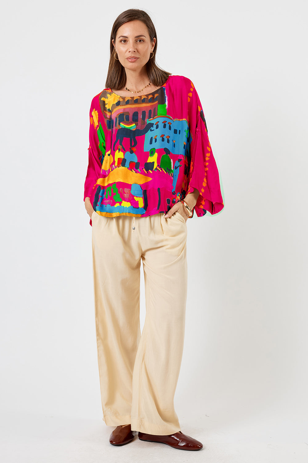 Image of a model wearing Tops. Product name - LulaSoul Surrey Top Raspberry in Raspberry colour by brand - LulaSoul