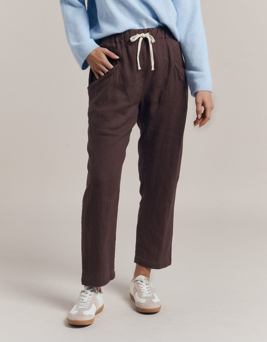 Image of a model wearing Pants. Product name - Luxe Linen Pants Chocolate in Chocolate colour by brand - Little Lies
