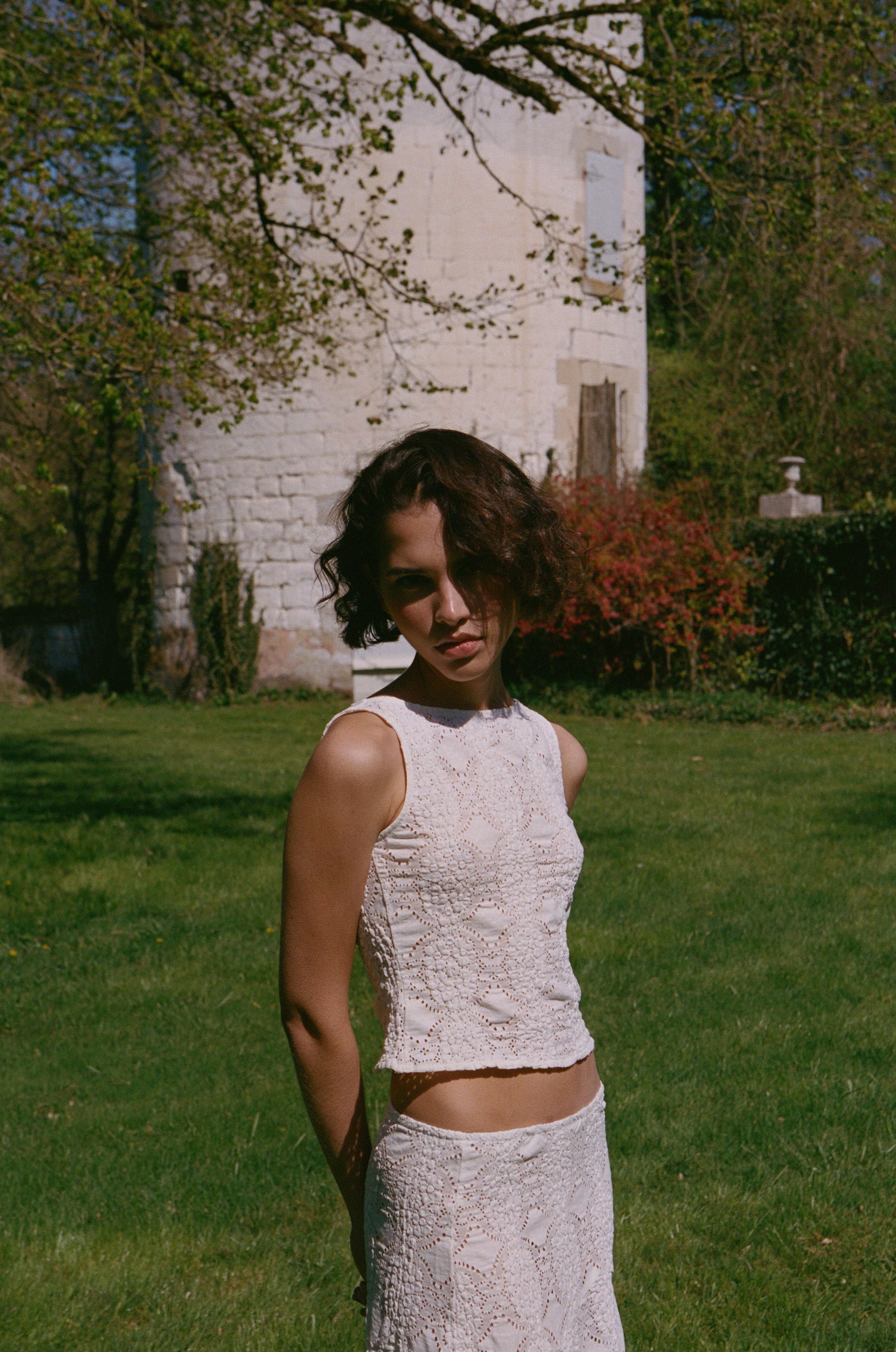 Image of a model wearing Tops. Product name - Maeve Top in White colour by brand - With Jéan