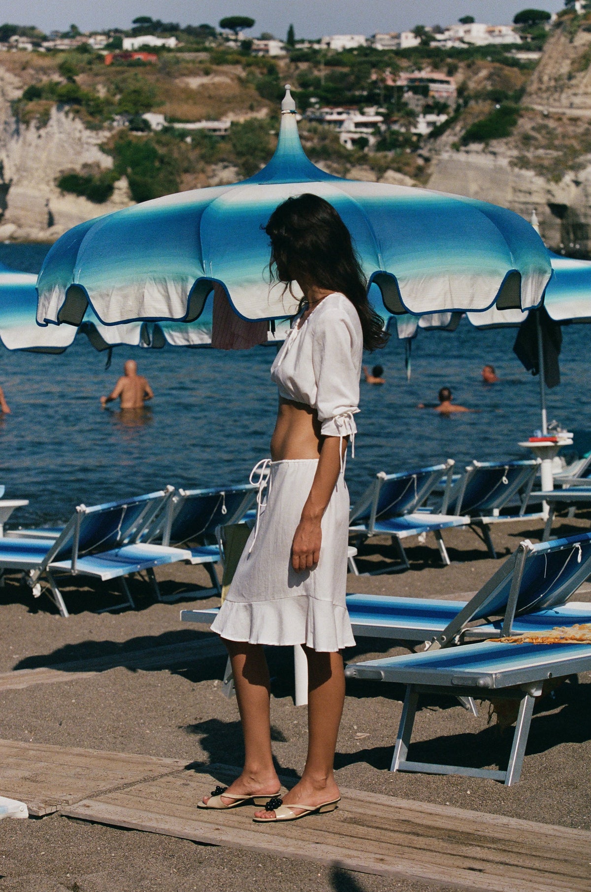 Image of a model wearing Skirts. Product name - Maisie Skirt in White colour by brand - With Jéan