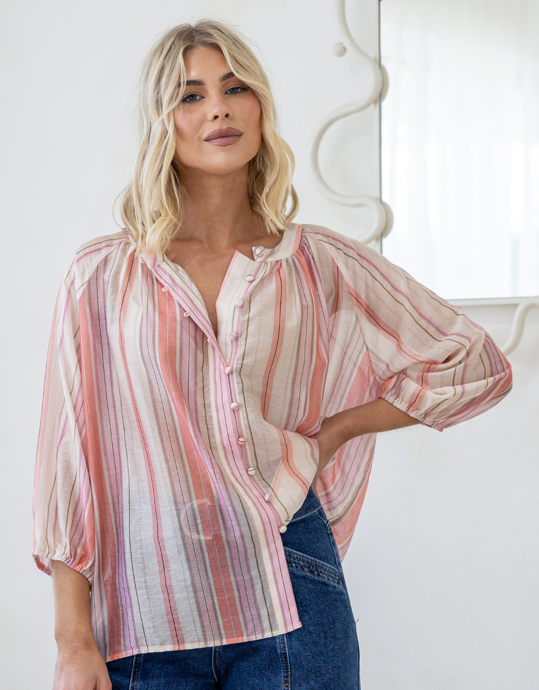 Image of a model wearing Tops. Product name - Malta Blouse Sunset Stripe in Sunset Stripe colour by brand - 132 Fashion