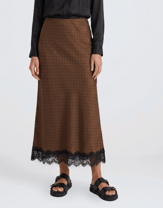 Image of a model wearing Skirts. Product name - Margarita Satin Lace Trim Bias Maxi Skirt Chocolate Polka Dot in Chocolate Polka Dot colour by brand - Georgia Zoe