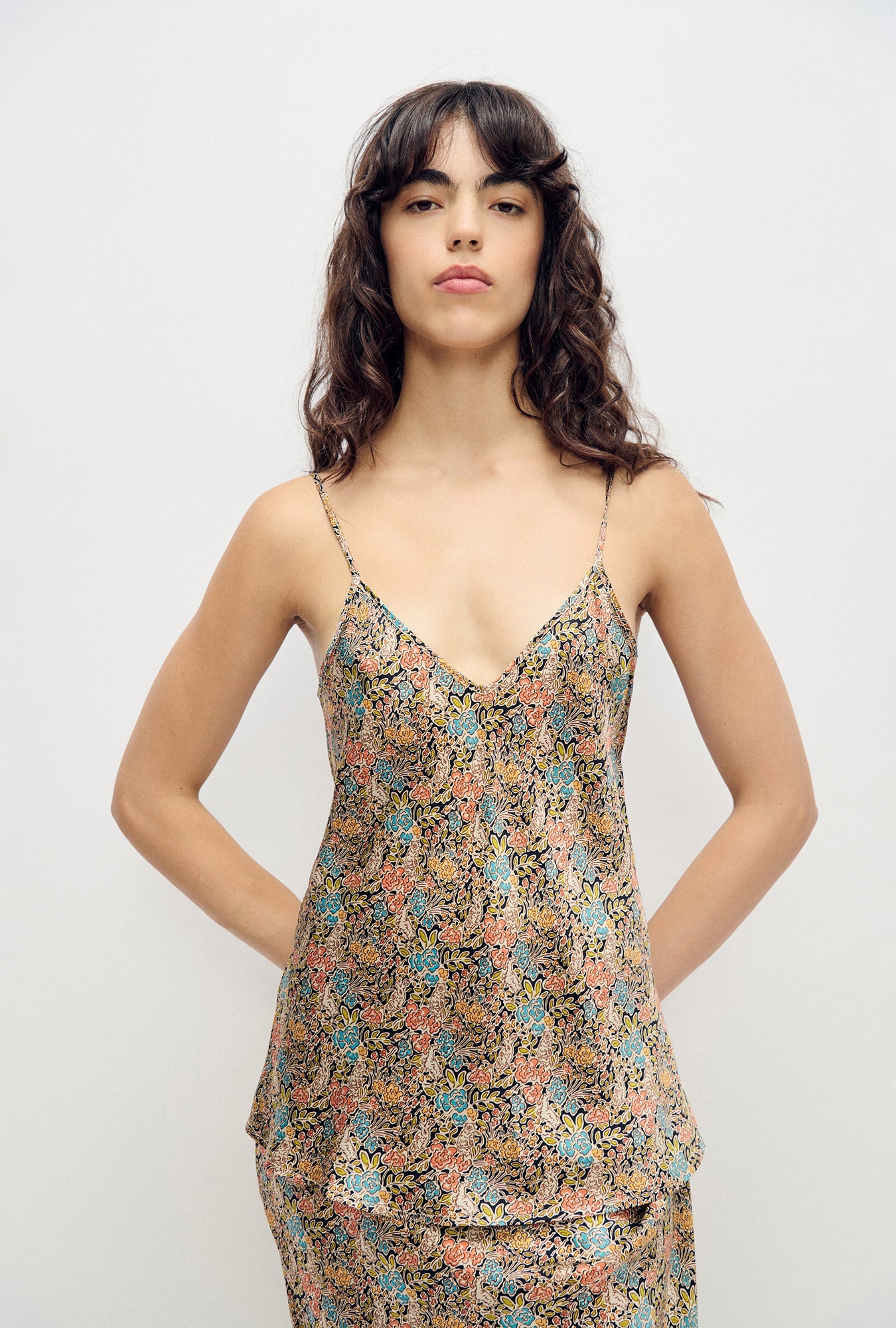 Image of a model wearing Tops. Product name - Bias Cut Cami Sugar Floral in Sugar Floral colour by brand - Silk Laundry