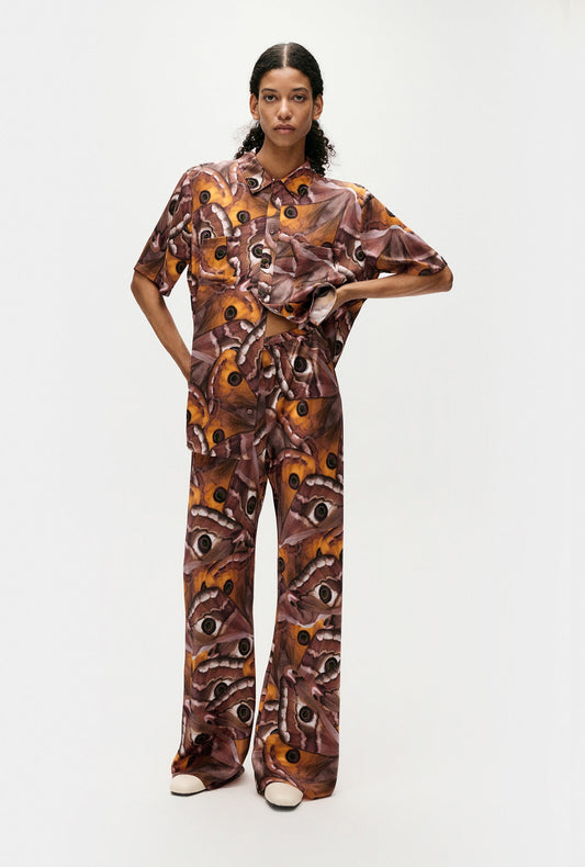 Image of a model wearing Tops. Product name - Short Sleeve Boyfriend Shirt Wingspan in Wingspan colour by brand - Silk Laundry