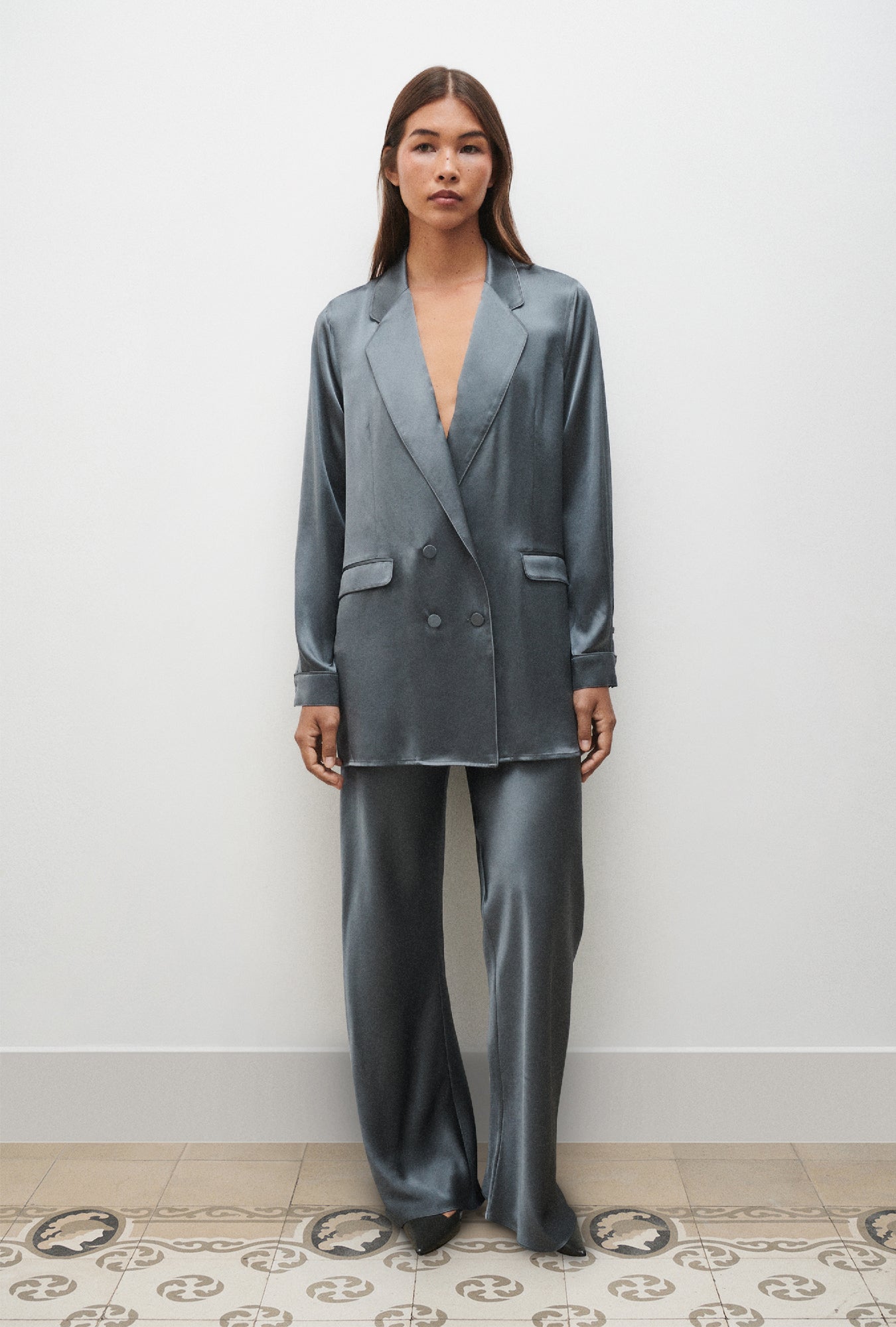 Image of a model wearing Outerwear. Product name - Relaxed Blazer Slate in Slate colour by brand - Silk Laundry