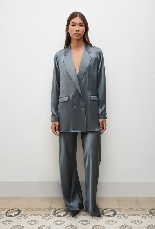 Image of a model wearing Outerwear. Product name - Relaxed Blazer Slate in Slate colour by brand - Silk Laundry