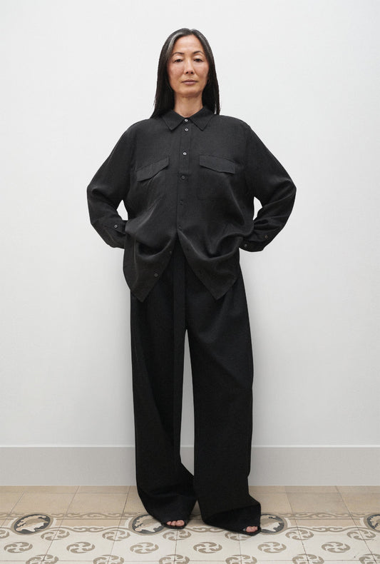 Image of a model wearing Tops. Productname: Silk Laundry BOYFRIEND SHIRT in Black colour by brand - Silk Laundry