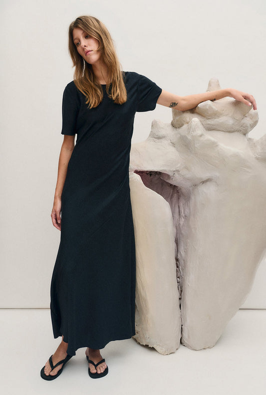 Image of a model wearing Tops. Productname: Silk Laundry Short Sleeve Bias Dress in Coral Jacquard colour by brand - Silk Laundry