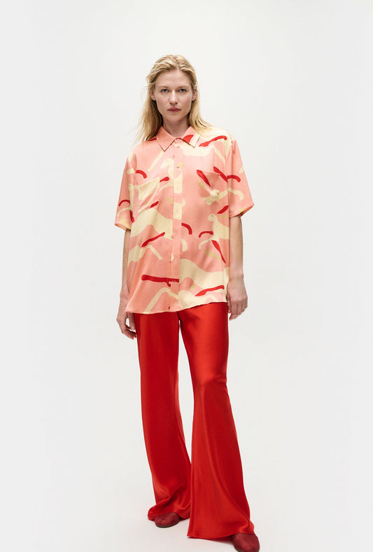 Image of a model wearing Tops. Product name - Short Sleeve Boyfriend Shirt Rabbit Amaranth in Rabbit Amaranth colour by brand - Silk Laundry