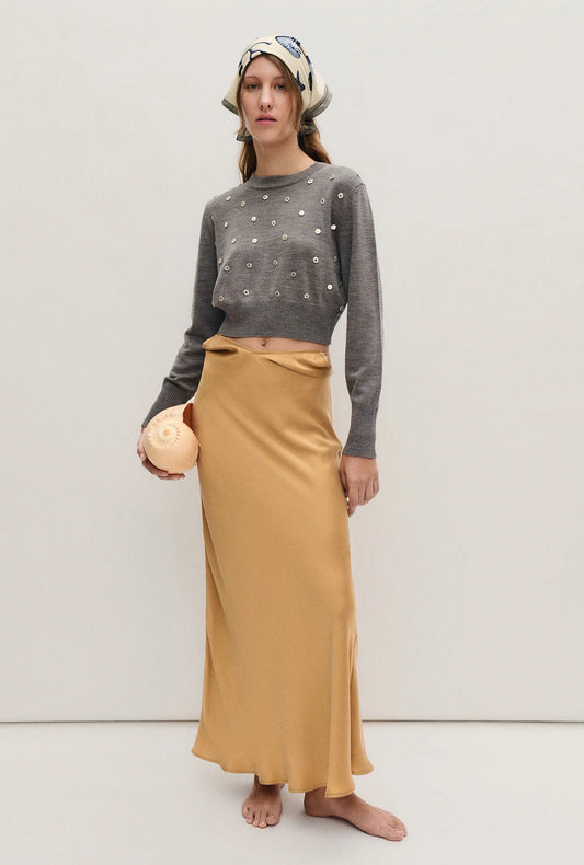 Image of a model wearing Outerwear. Product name - Cropped Crewneck Pearl in Pearl colour by brand - Silk Laundry
